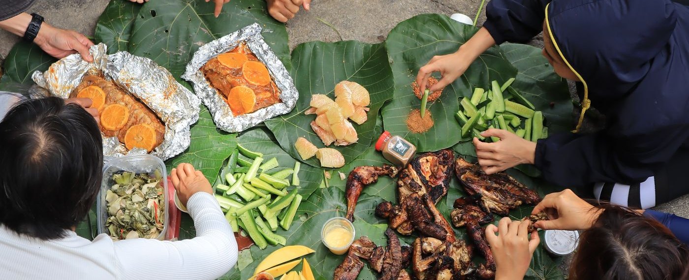 Illustrative stock photo of friends sharing a barbecue outdoors